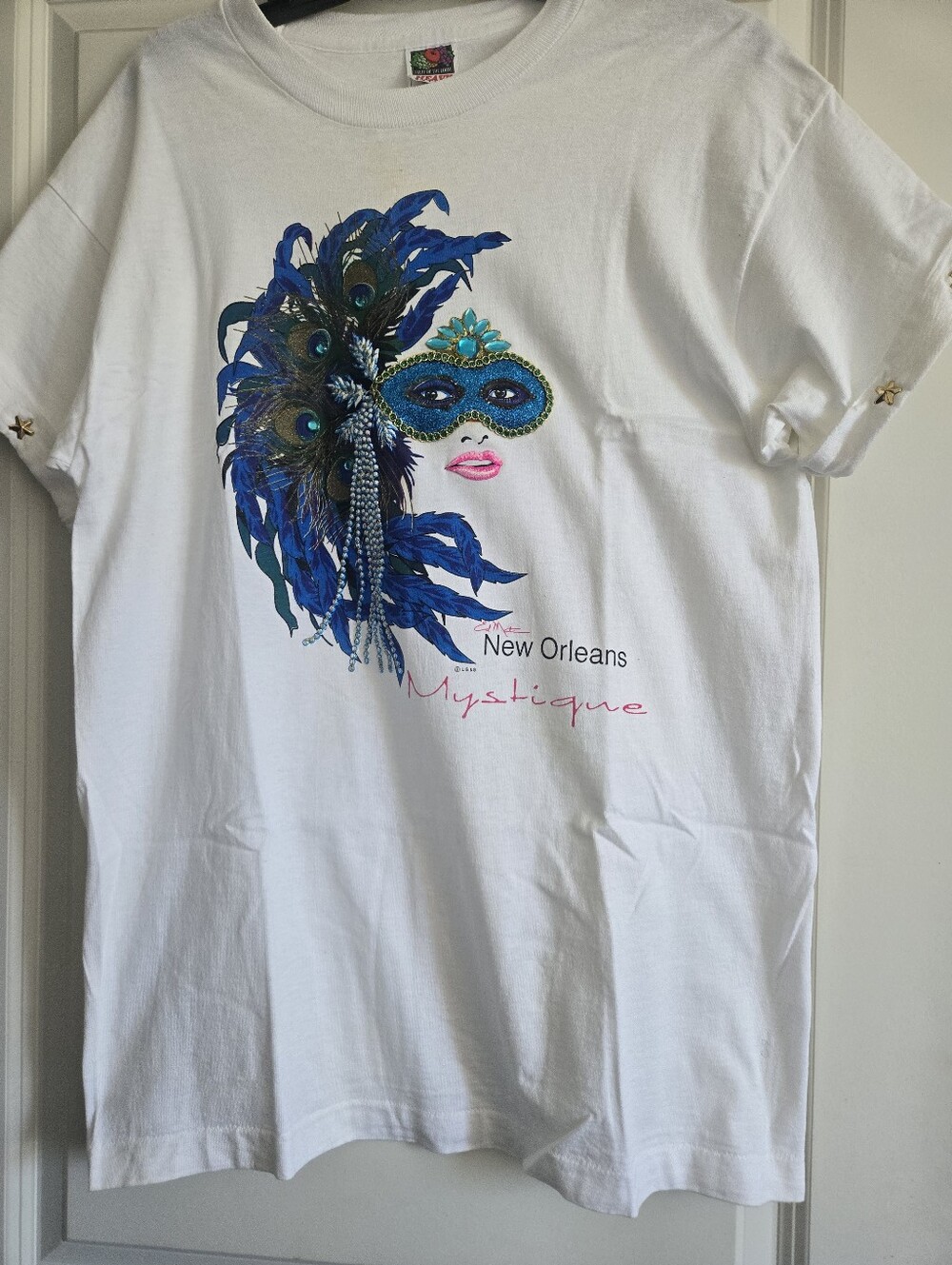 New Orleans Mystique White T-Shirt with Blue Feather Mask Graphic